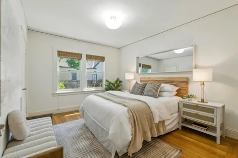 a bedroom with a bed and a couch