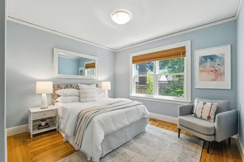 a bedroom with a bed and a couch