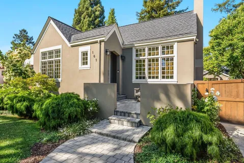 a front view of a house with garden