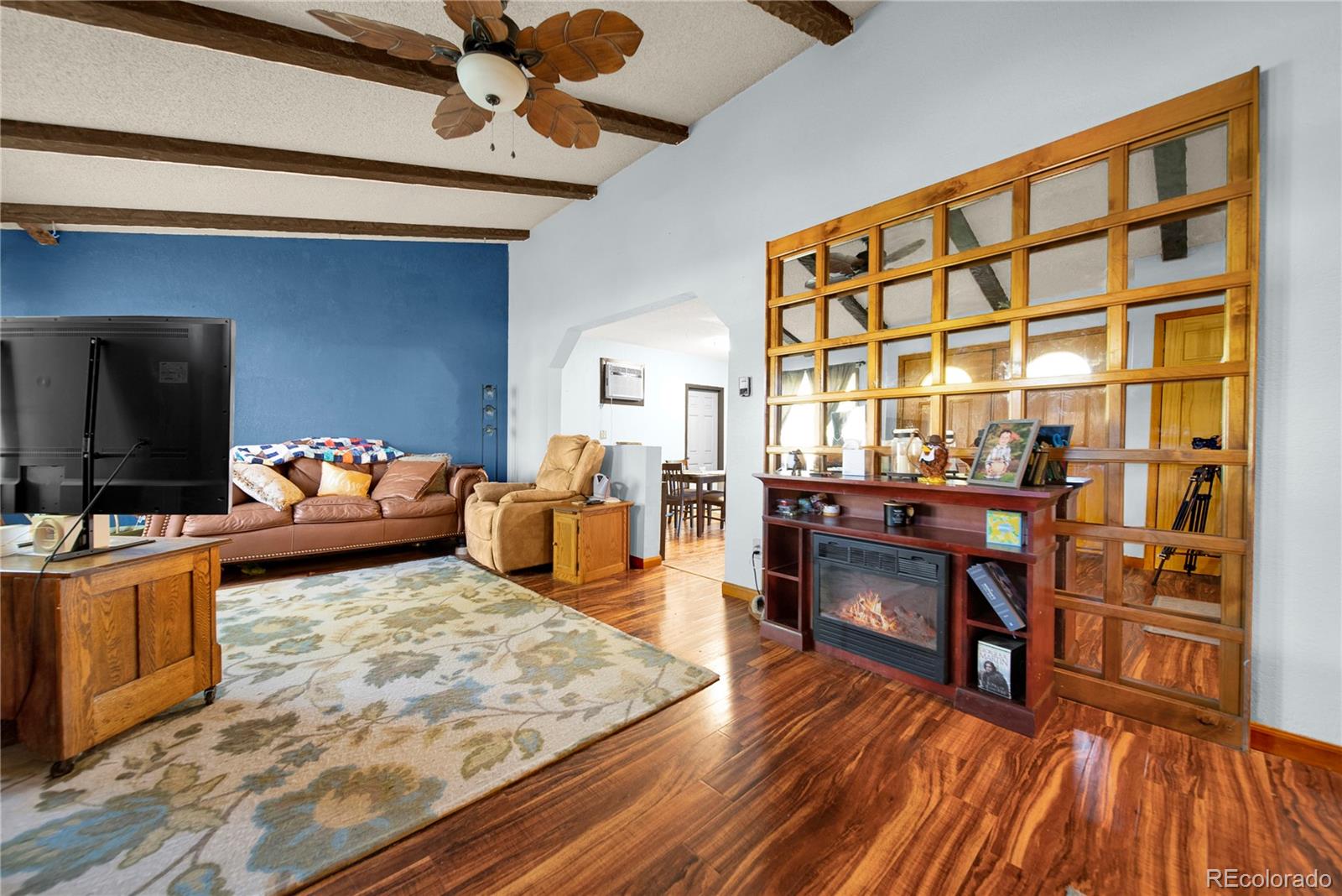 404 Hickory Street Fort Morgan, CO 80701 - Photo 14 of 37 a living room with furniture and a flat screen tv