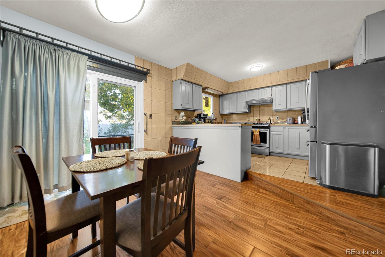 404 Hickory Street Fort Morgan, CO 80701 - Photo 16 of 37 a kitchen with a table and chairs in it