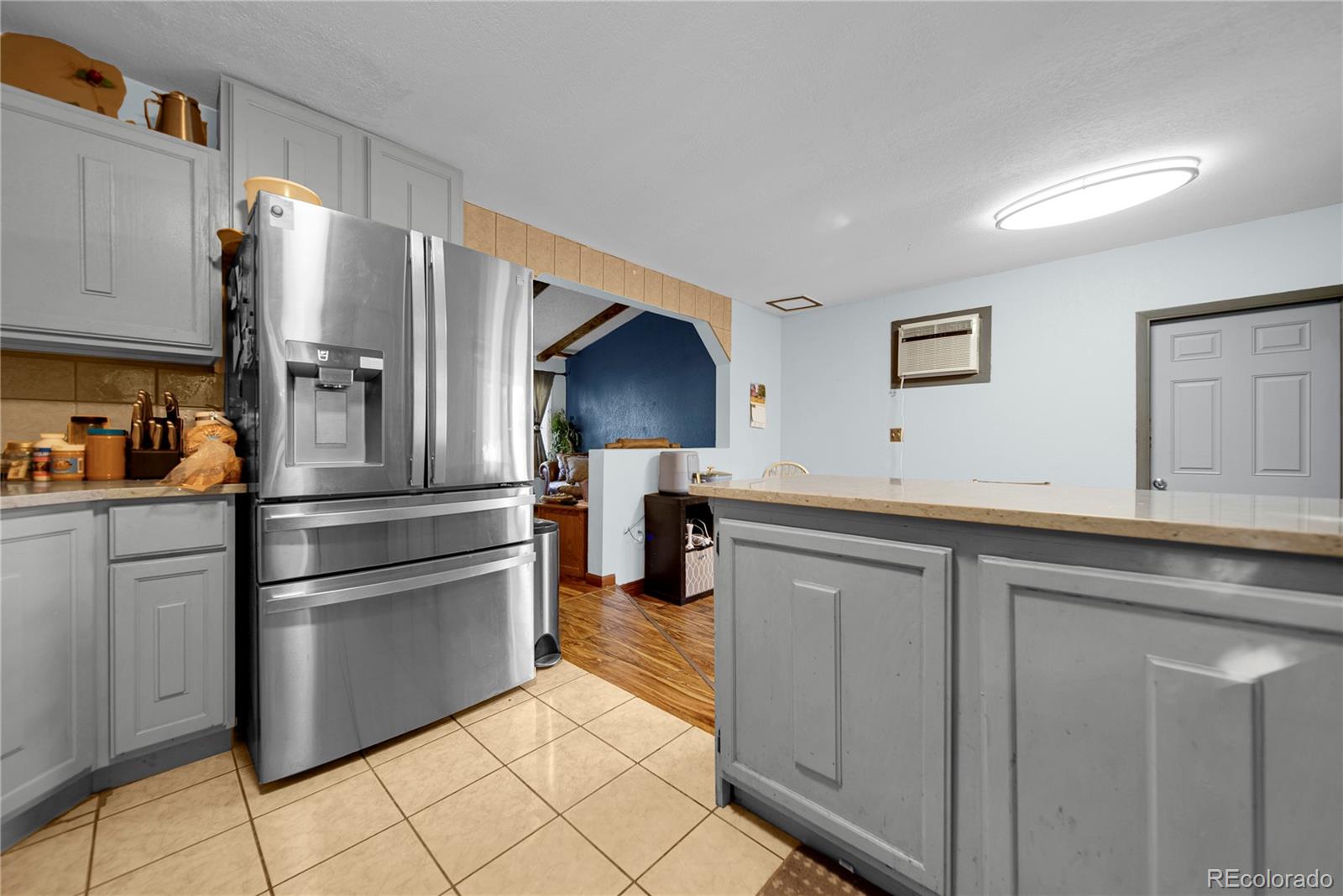 404 Hickory Street Fort Morgan, CO 80701 - Photo 18 of 37 a kitchen with stainless steel appliances a refrigerator and a sink