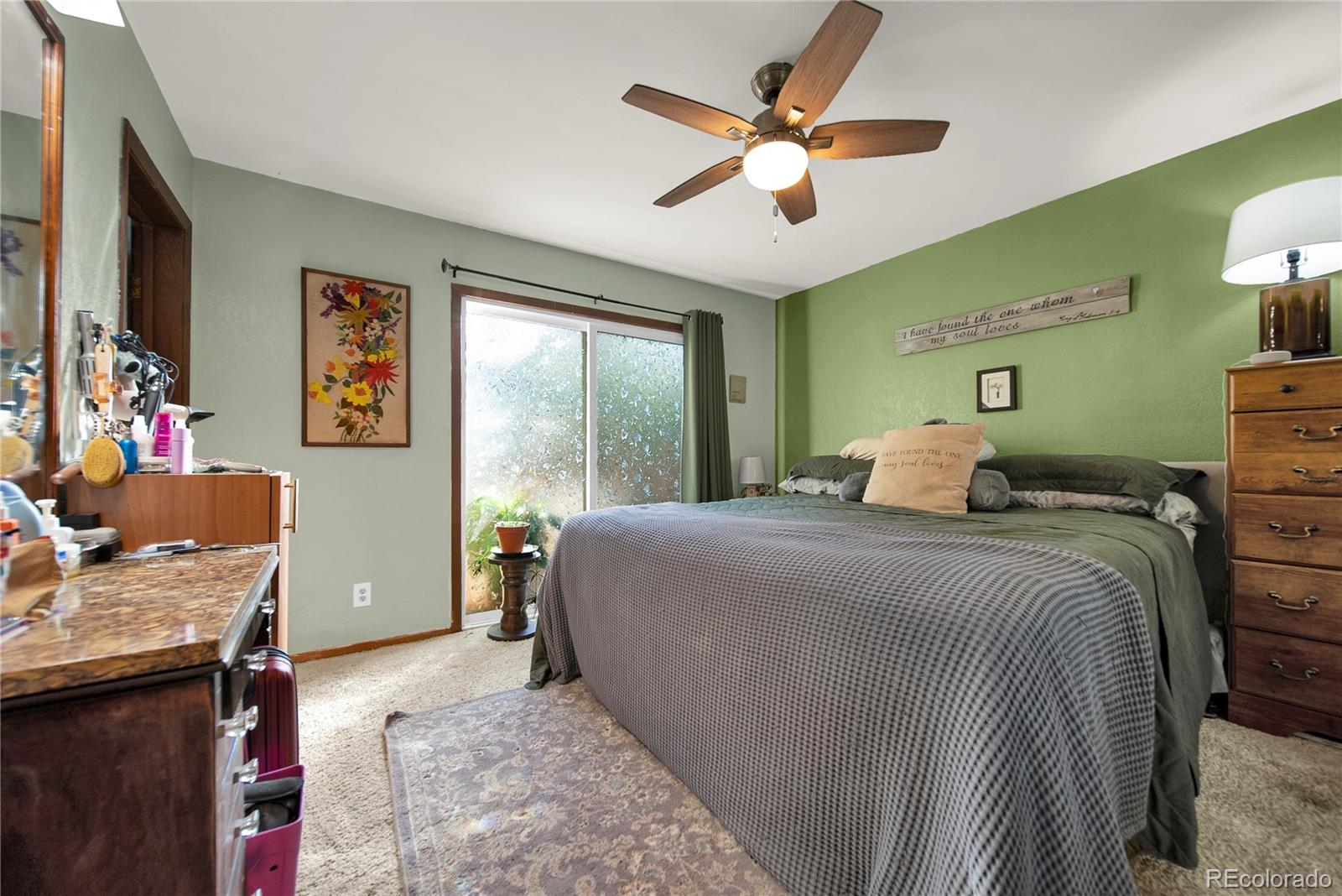 404 Hickory Street Fort Morgan, CO 80701 - Photo 20 of 37 a bedroom with a bed window and a desk