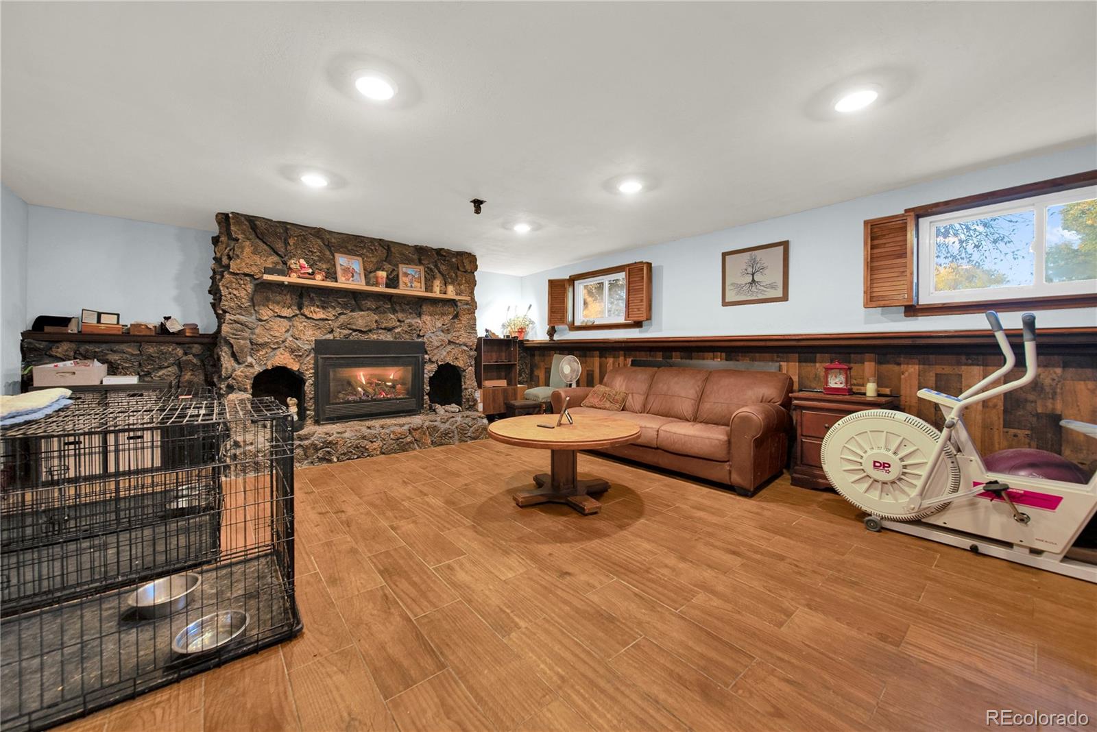 404 Hickory Street Fort Morgan, CO 80701 - Photo 25 of 37 a living room with furniture a fireplace and window