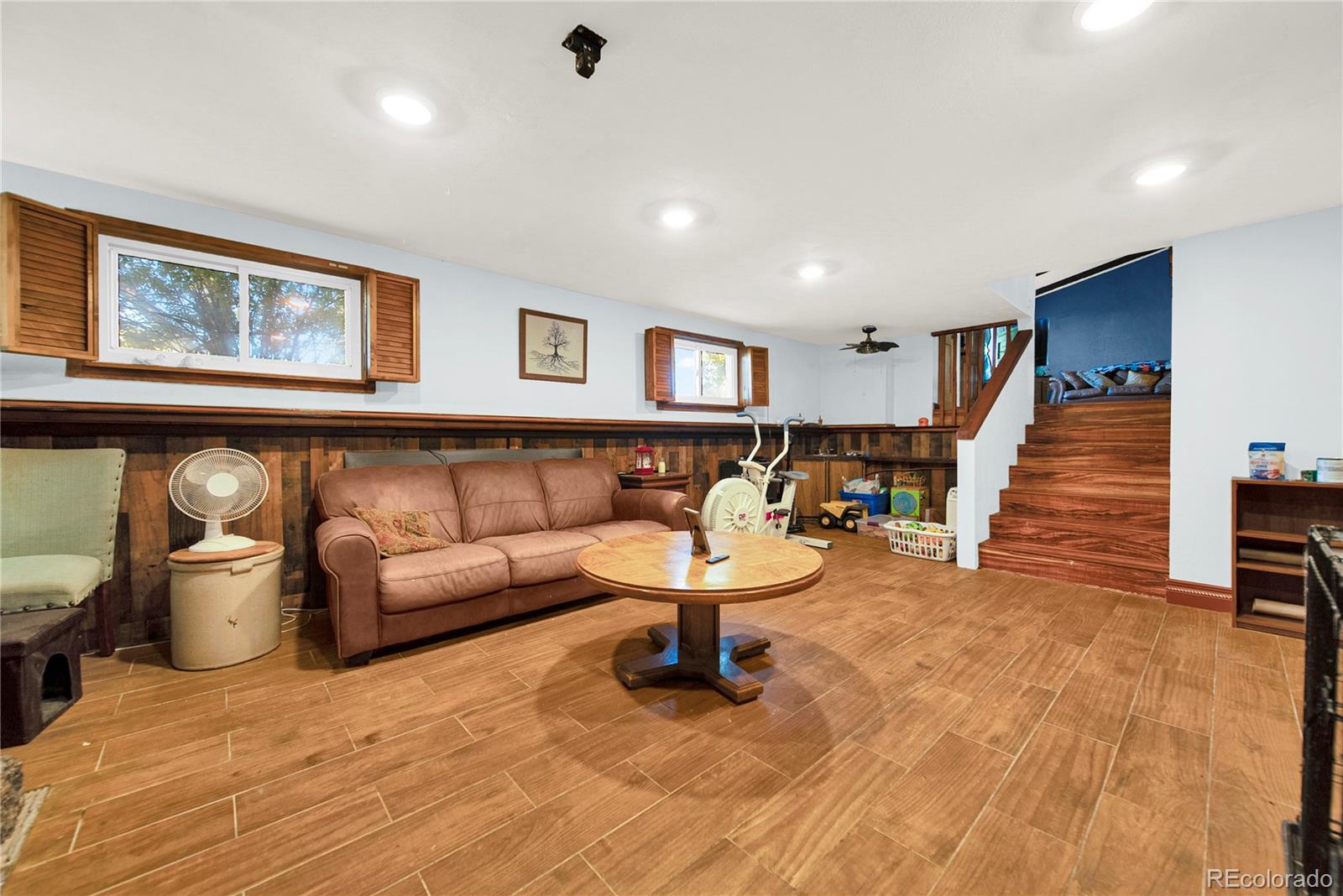 404 Hickory Street Fort Morgan, CO 80701 - Photo 27 of 37 a living room with furniture and a wooden floor
