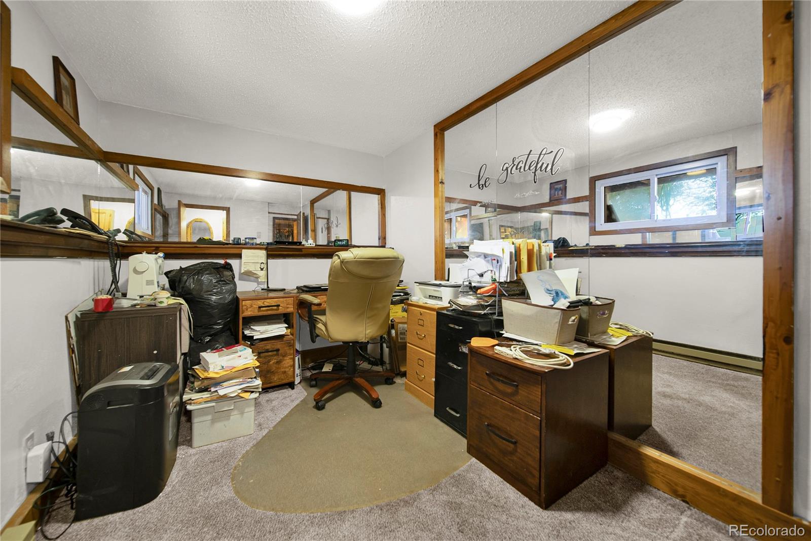 404 Hickory Street Fort Morgan, CO 80701 - Photo 30 of 37 a view of a workspace with furniture and a livingroom