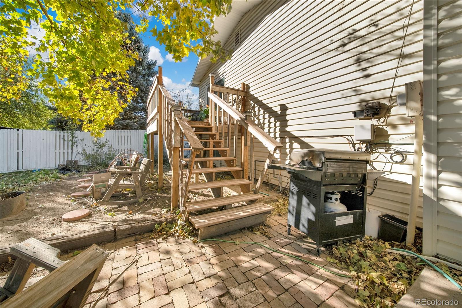 404 Hickory Street Fort Morgan, CO 80701 - Photo 33 of 37 a view of a yard with plants and wooden fence