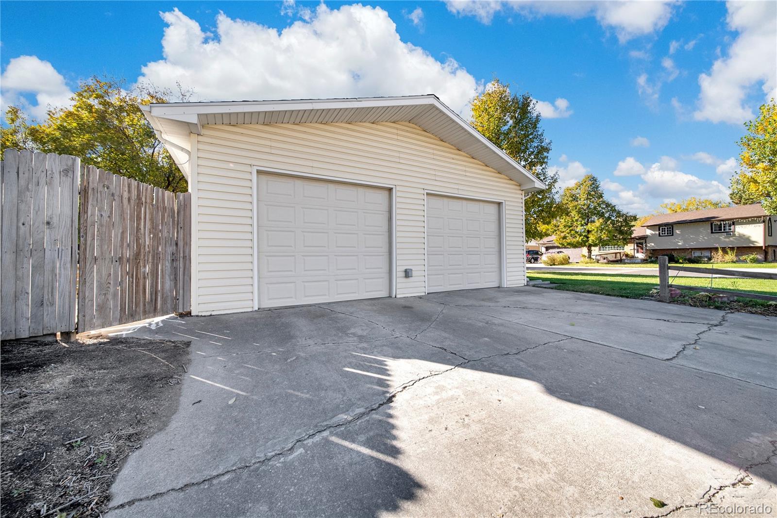 404 Hickory Street Fort Morgan, CO 80701 - Photo 9 of 37 a view of a house with a backyard and porch