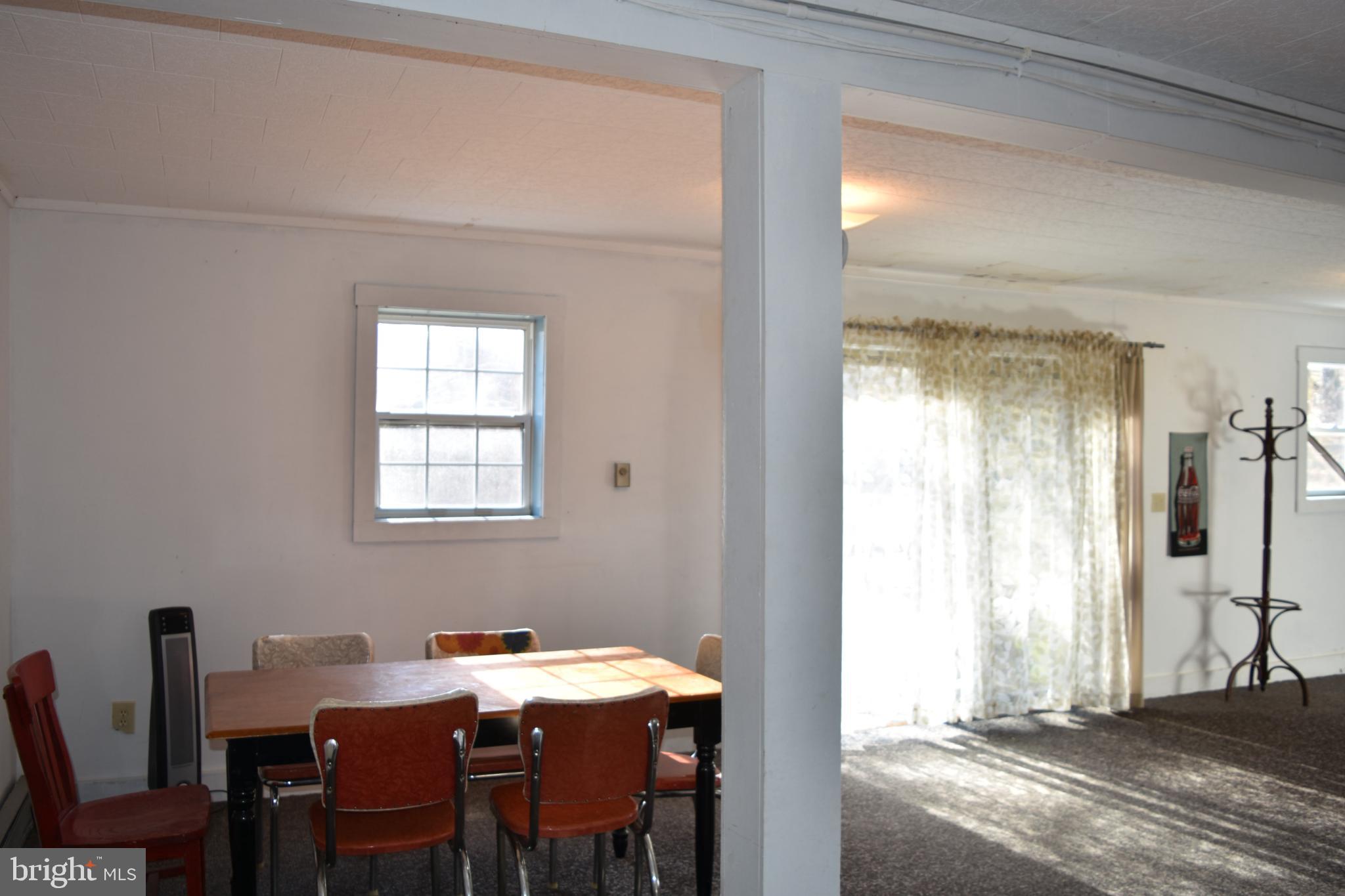 1417 Mountainside Road Berkeley Springs, WV 25411 - Photo 20 of 76 Bright and airy dining space with natural light.