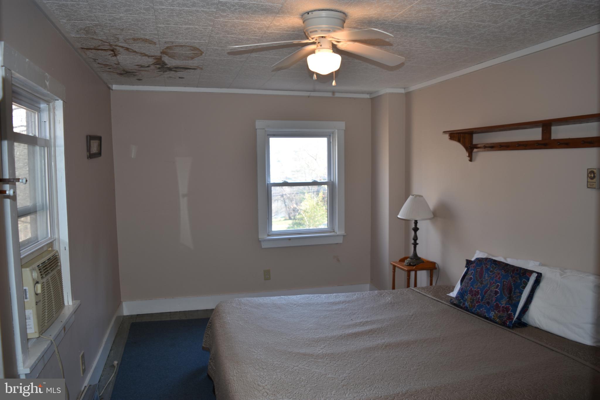 1417 Mountainside Road Berkeley Springs, WV 25411 - Photo 25 of 76 Cozy bedroom with natural light and charm.