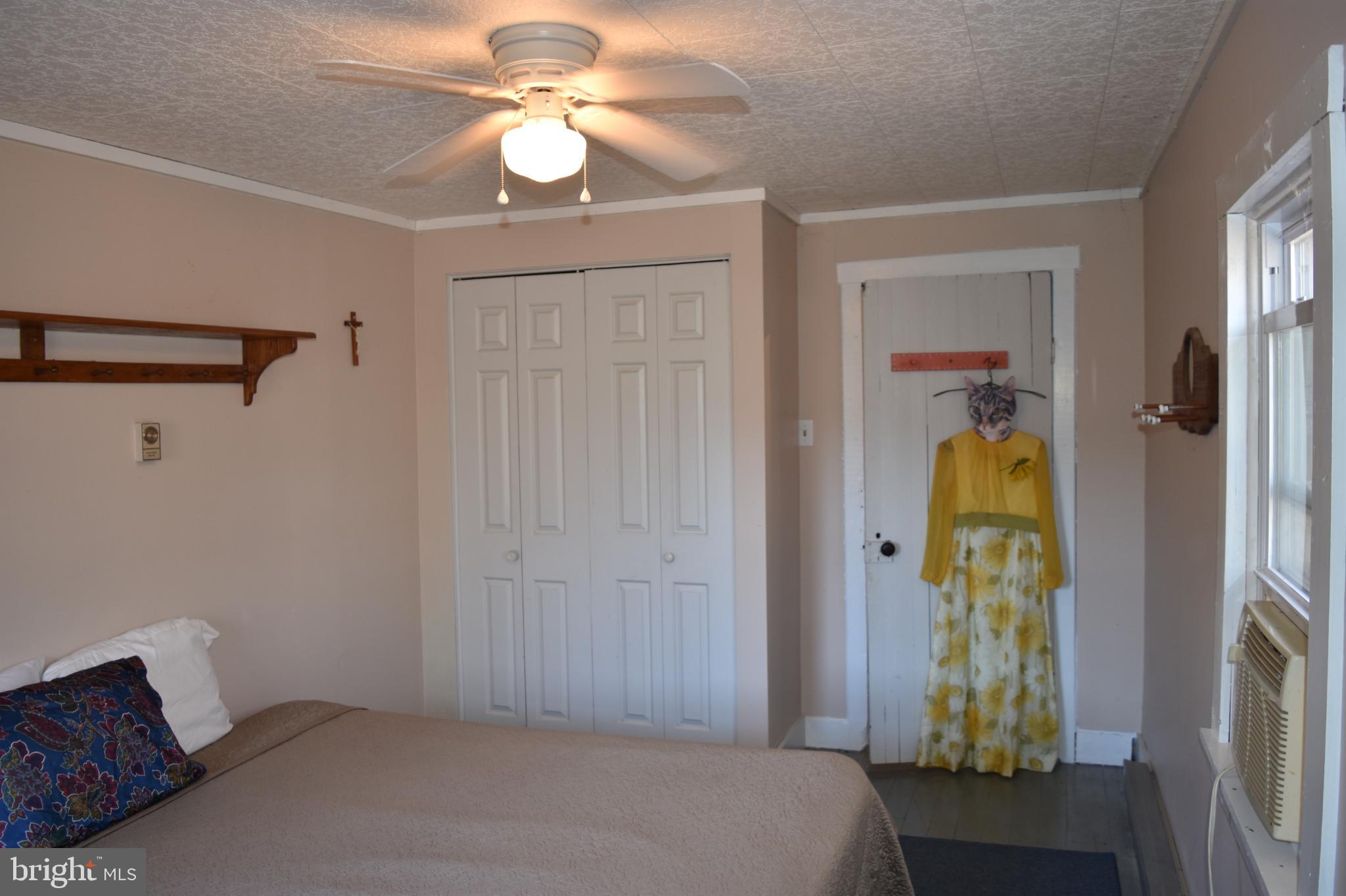 1417 Mountainside Road Berkeley Springs, WV 25411 - Photo 27 of 76 Cozy bedroom with natural light and charm.