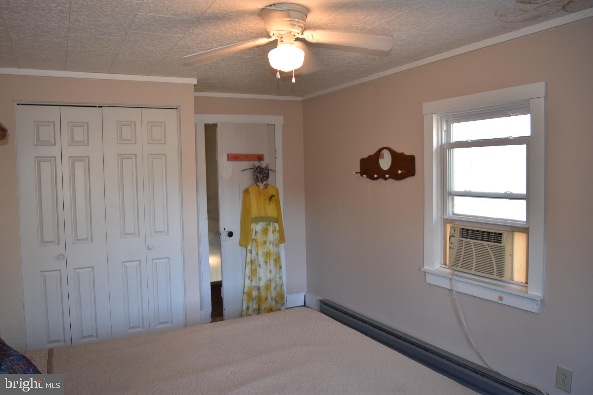 1417 Mountainside Road Berkeley Springs, WV 25411 - Photo 28 of 76 Cozy bedroom with natural light and charm.
