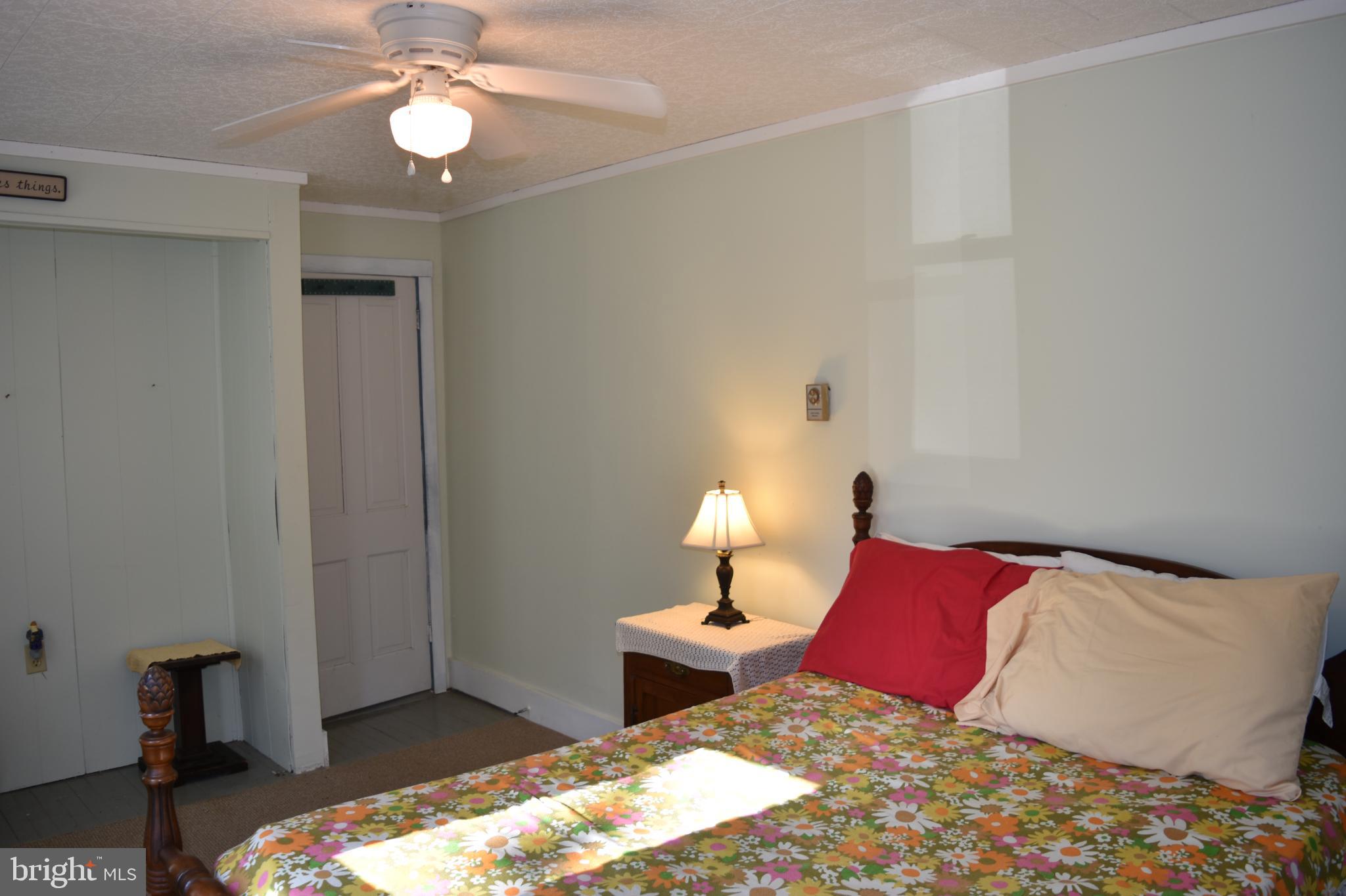 1417 Mountainside Road Berkeley Springs, WV 25411 - Photo 30 of 76 Cozy bedroom with natural light and charm.