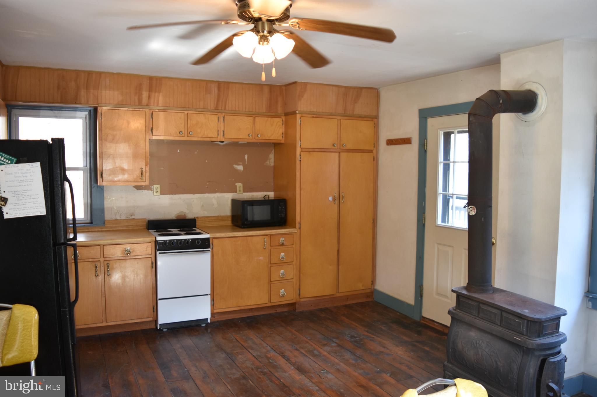 1417 Mountainside Road Berkeley Springs, WV 25411 - Photo 3 of 76 Cozy kitchen with rustic charm and warmth.