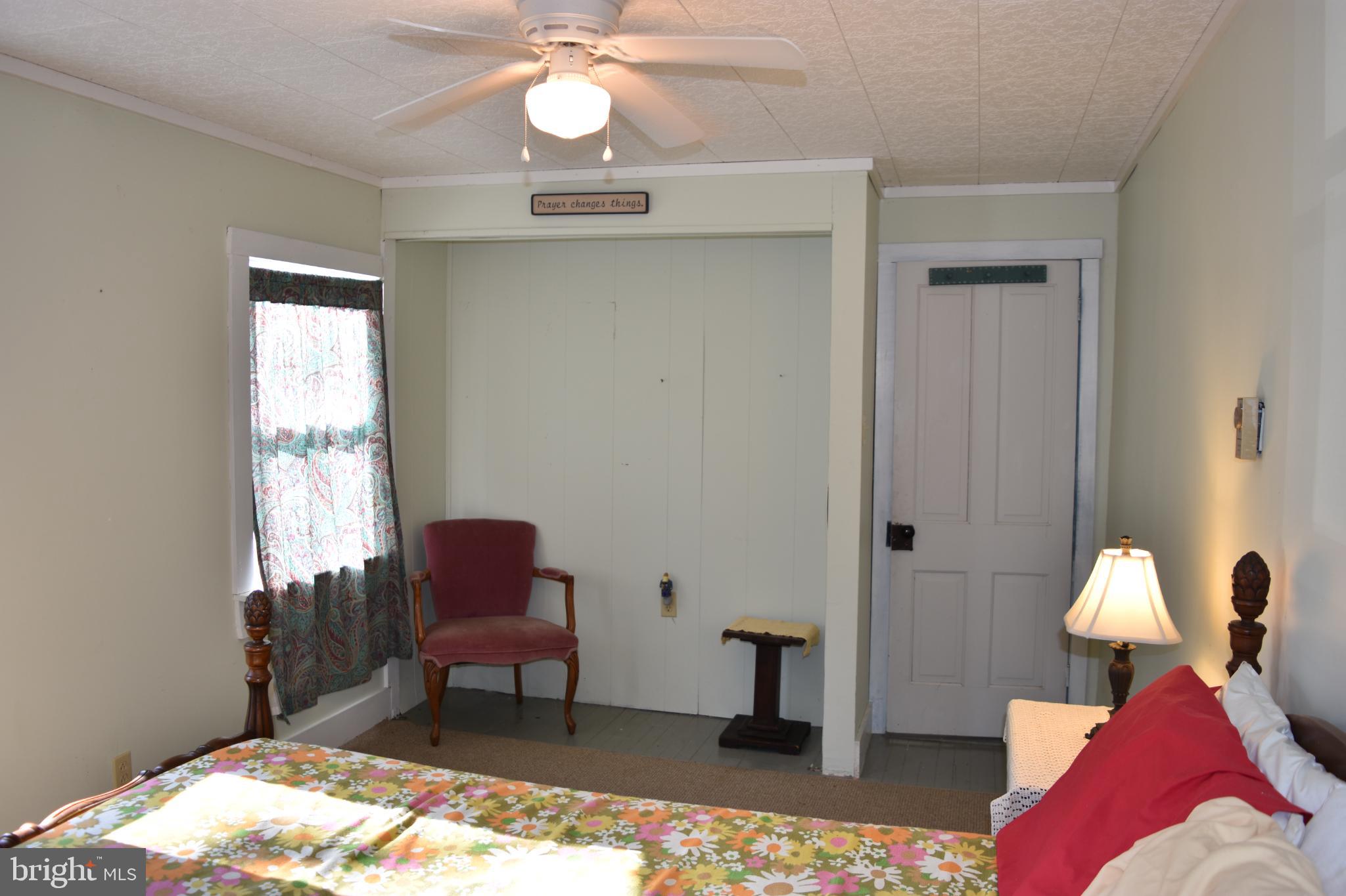 1417 Mountainside Road Berkeley Springs, WV 25411 - Photo 31 of 76 Cozy bedroom with vintage charm and light.