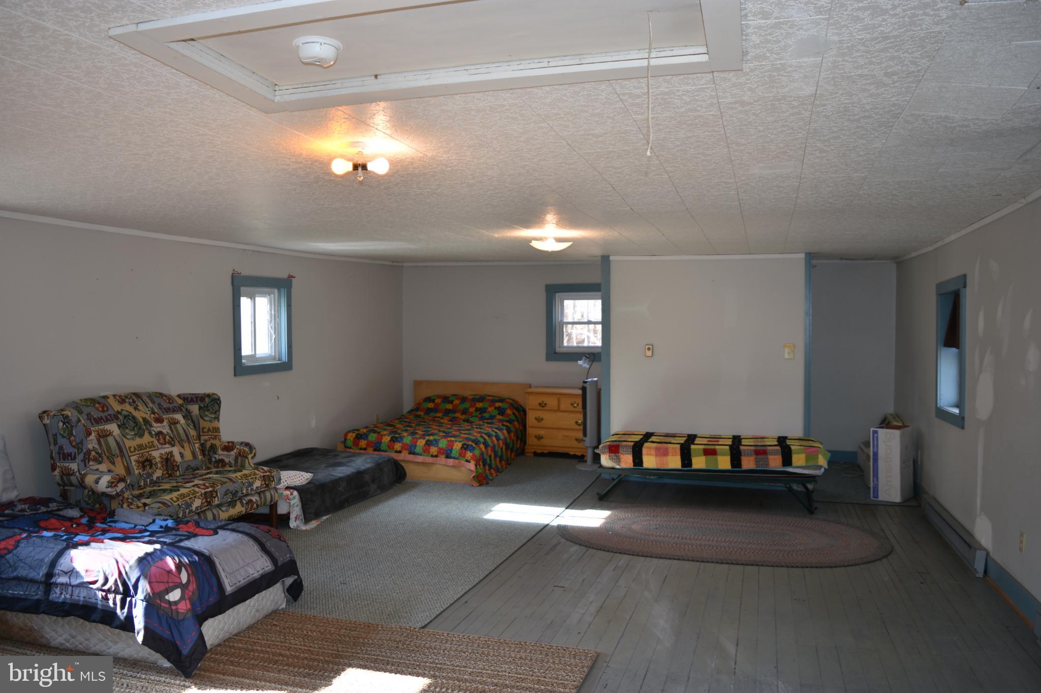 1417 Mountainside Road Berkeley Springs, WV 25411 - Photo 35 of 76 Spacious room with cozy sleeping areas.