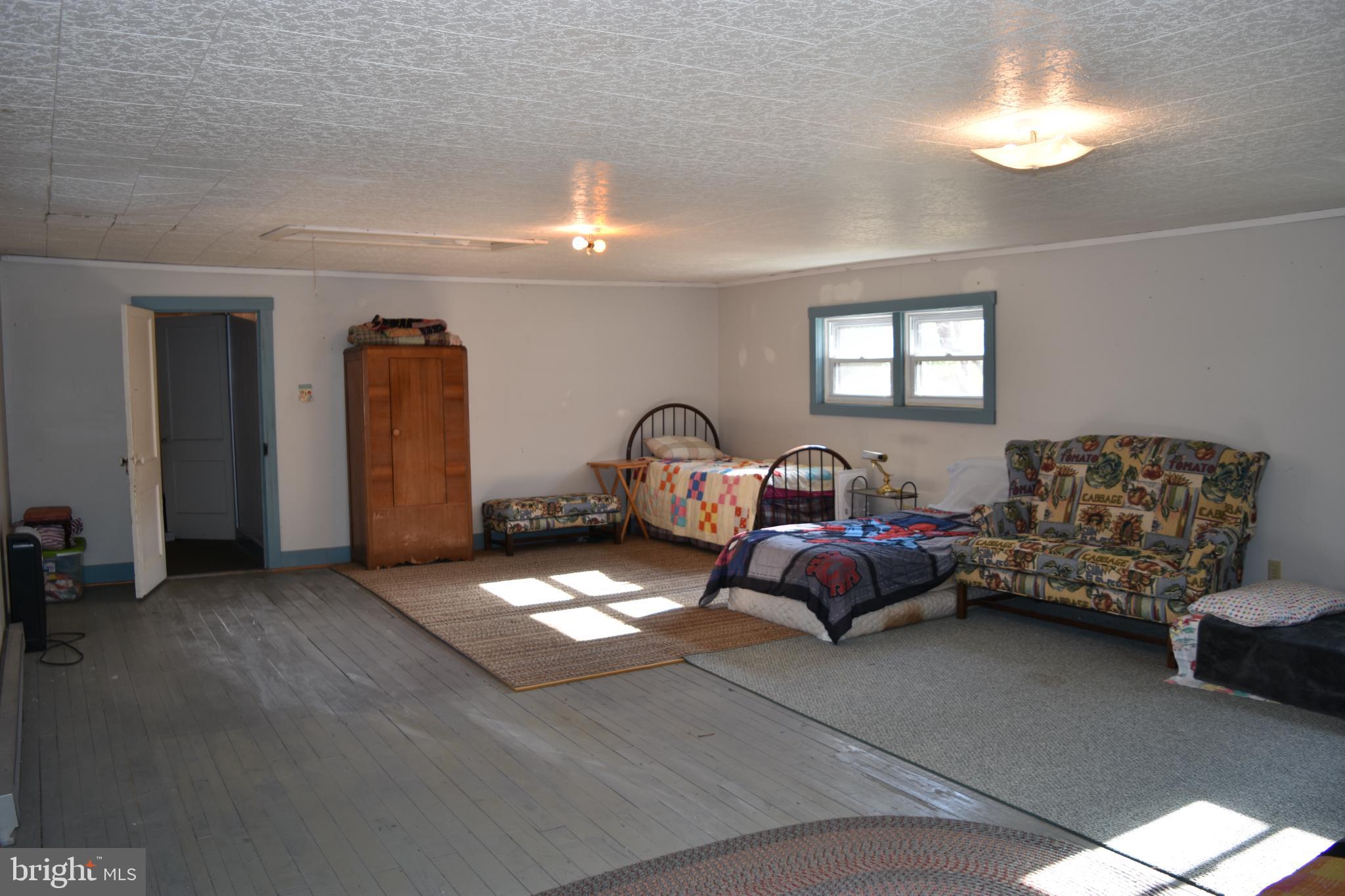 1417 Mountainside Road Berkeley Springs, WV 25411 - Photo 38 of 76 Spacious room with natural light and charm.