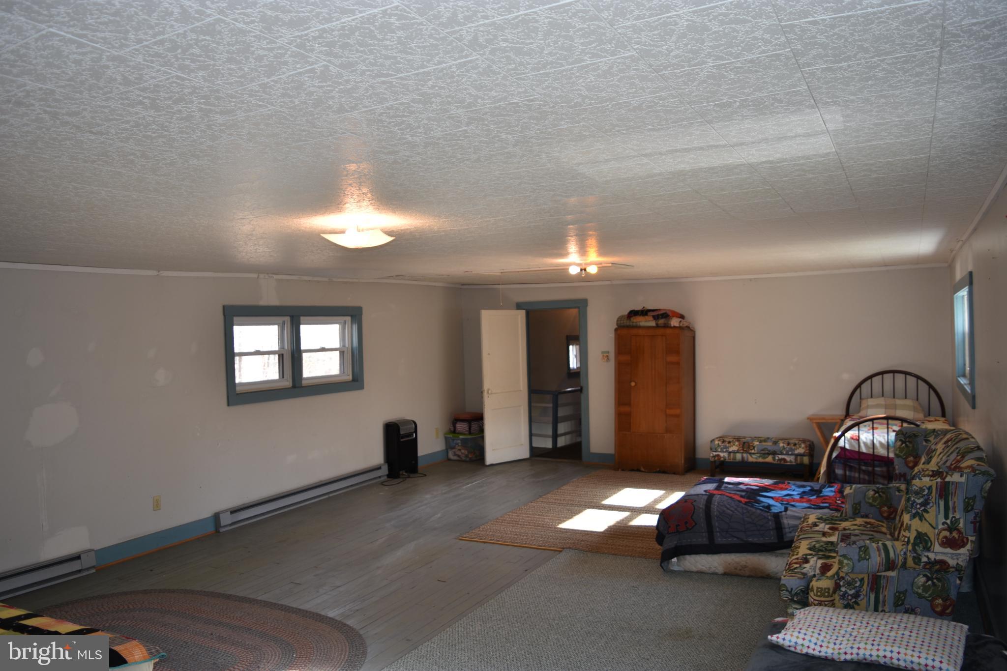 1417 Mountainside Road Berkeley Springs, WV 25411 - Photo 39 of 76 Spacious, sunlit room with endless potential.