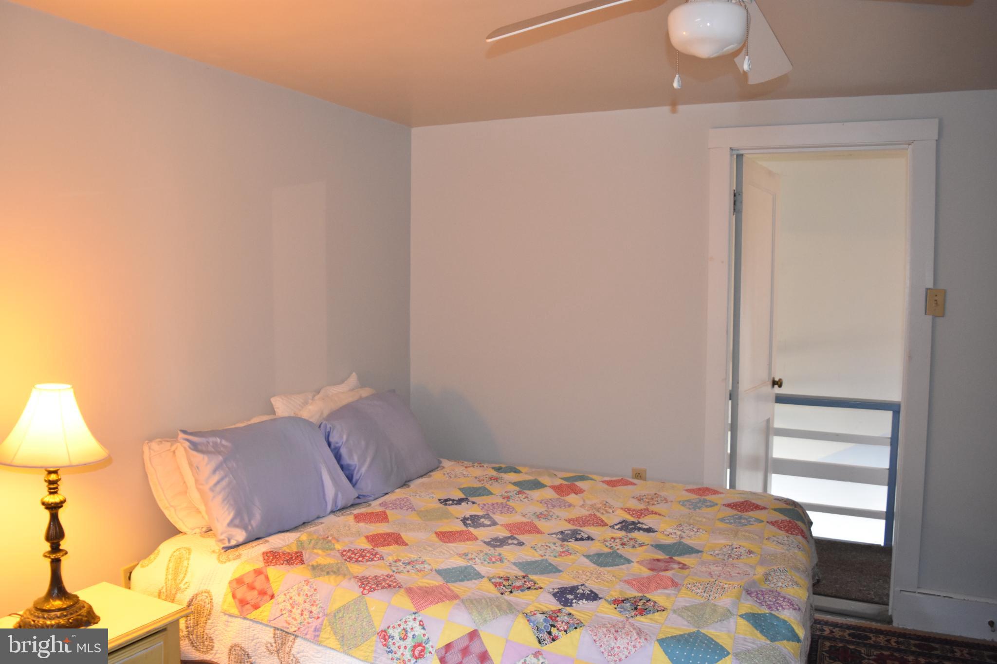1417 Mountainside Road Berkeley Springs, WV 25411 - Photo 42 of 76 Cozy bedroom with inviting pastel decor.