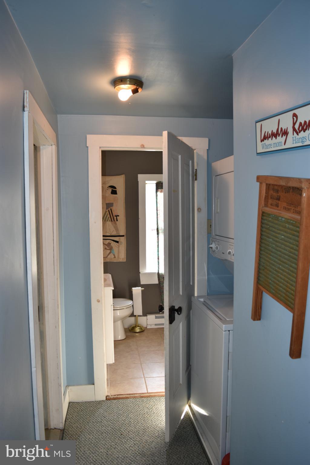 1417 Mountainside Road Berkeley Springs, WV 25411 - Photo 44 of 76 Charming hallway with inviting laundry access.
