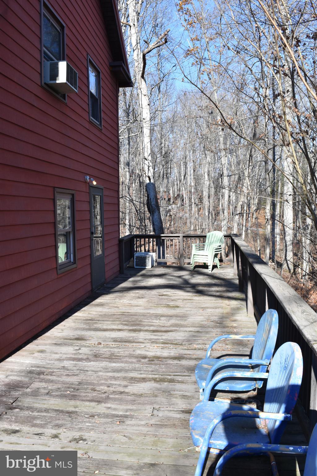 1417 Mountainside Road Berkeley Springs, WV 25411 - Photo 60 of 76 Serene deck overlooking tranquil woods.