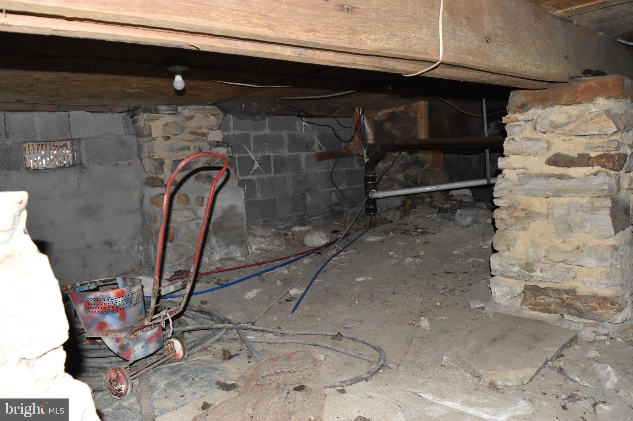 1417 Mountainside Road Berkeley Springs, WV 25411 - Photo 64 of 76 Cavernous underbelly of a rustic home.