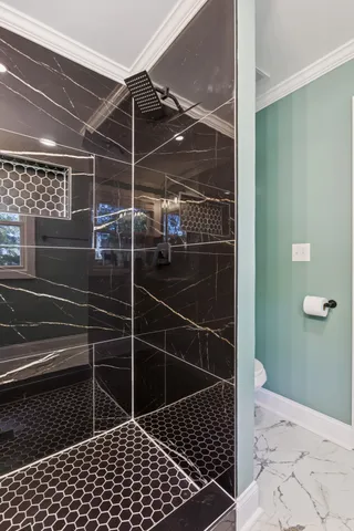 a view of a hallway with wooden floor and closet