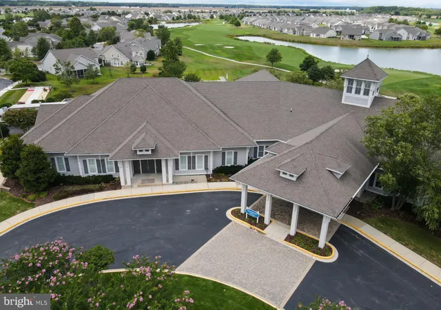 a view of a garden with wooden fence