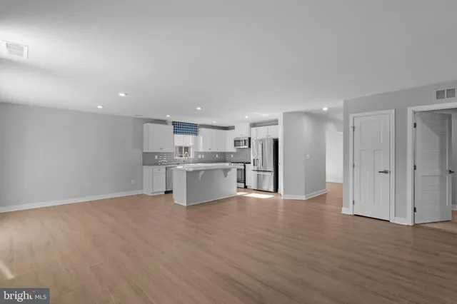 a view of kitchen with wooden floor