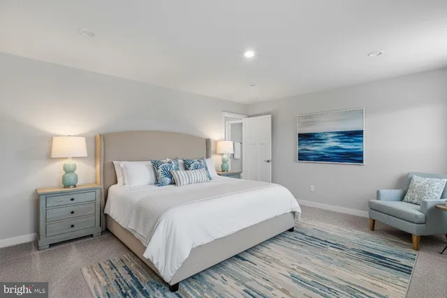 a bedroom with a bed and a couch