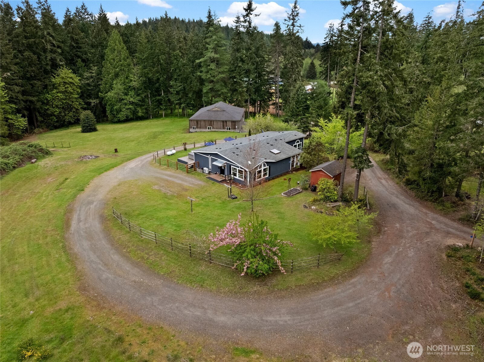 1998 Northwest Luoto Road Poulsbo, WA 98370 - Photo 1 of 40 a view of a swimming pool with a yard