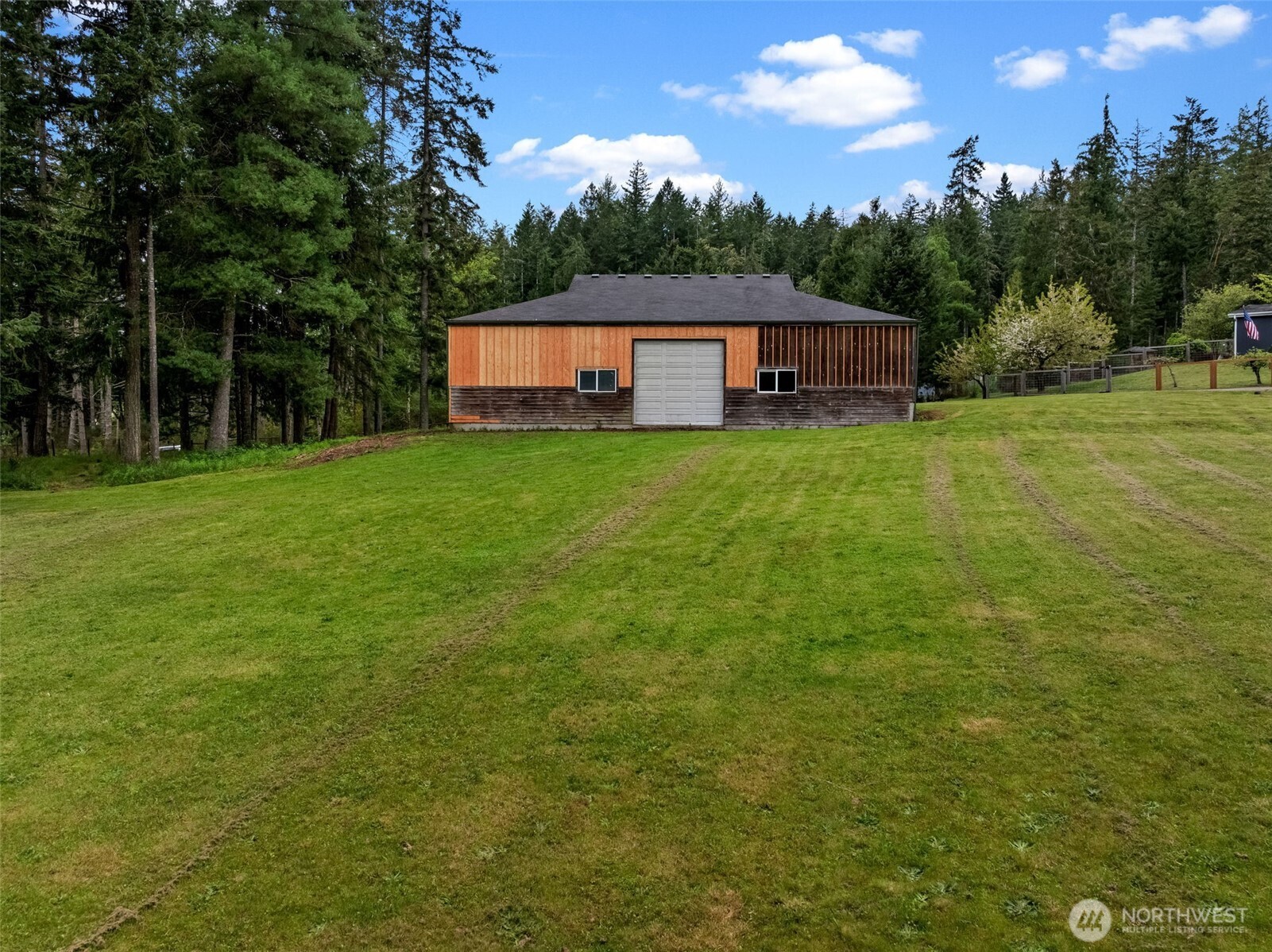 1998 Northwest Luoto Road Poulsbo, WA 98370 - Photo 31 of 40 a view of a house with a backyard