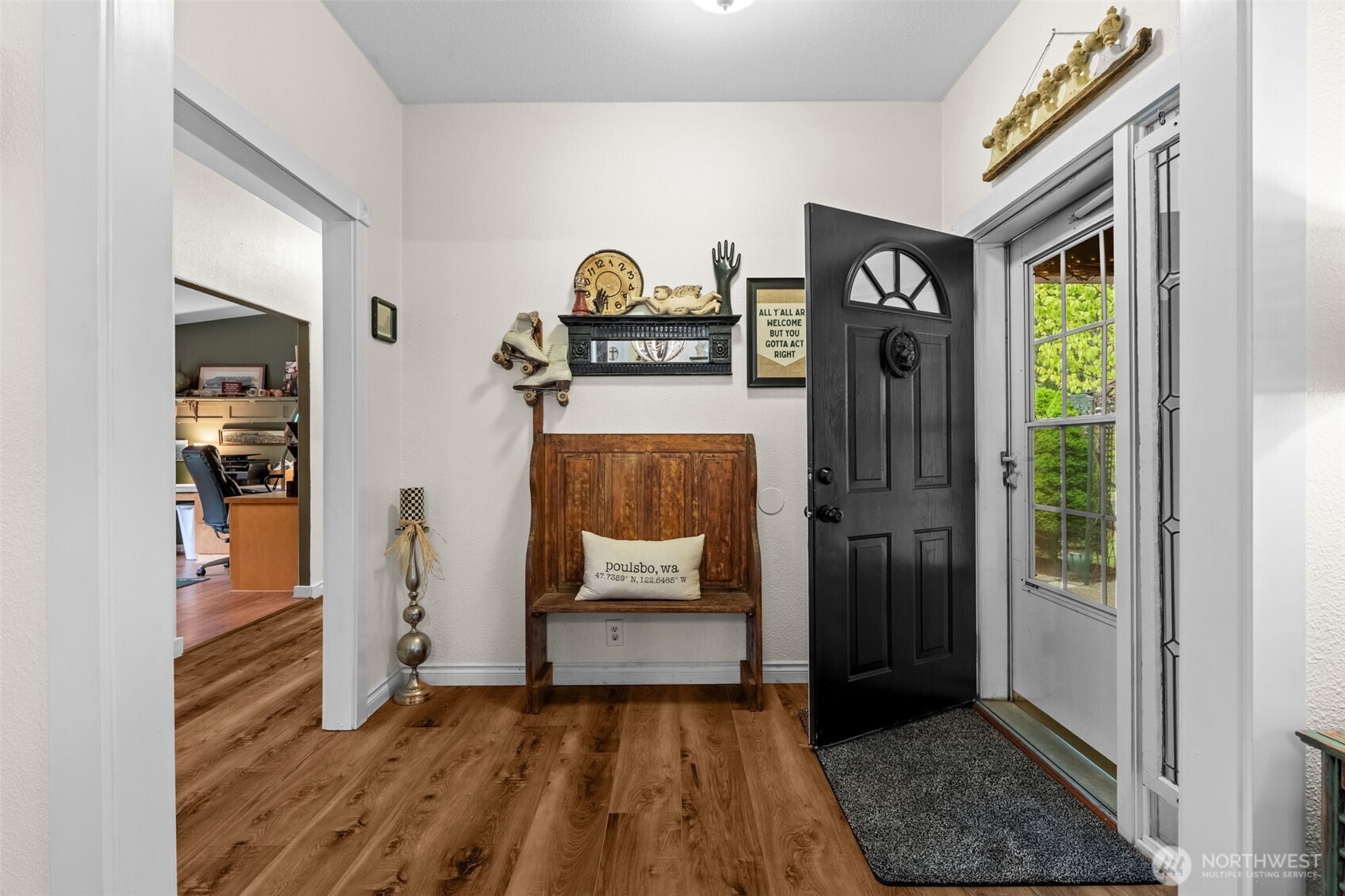 1998 Northwest Luoto Road Poulsbo, WA 98370 - Photo 4 of 40 a view of a hallway with wooden floor and a livingroom