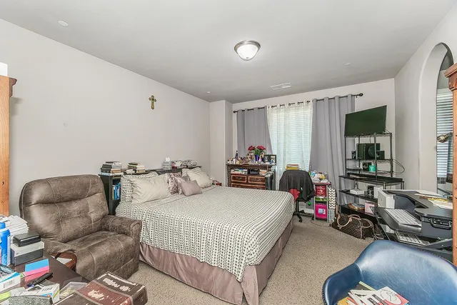 a bedroom with furniture and a couch