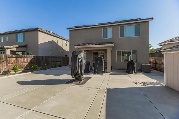an aerial view of houses with a yard