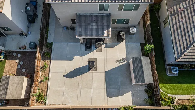 an aerial view of houses with a yard