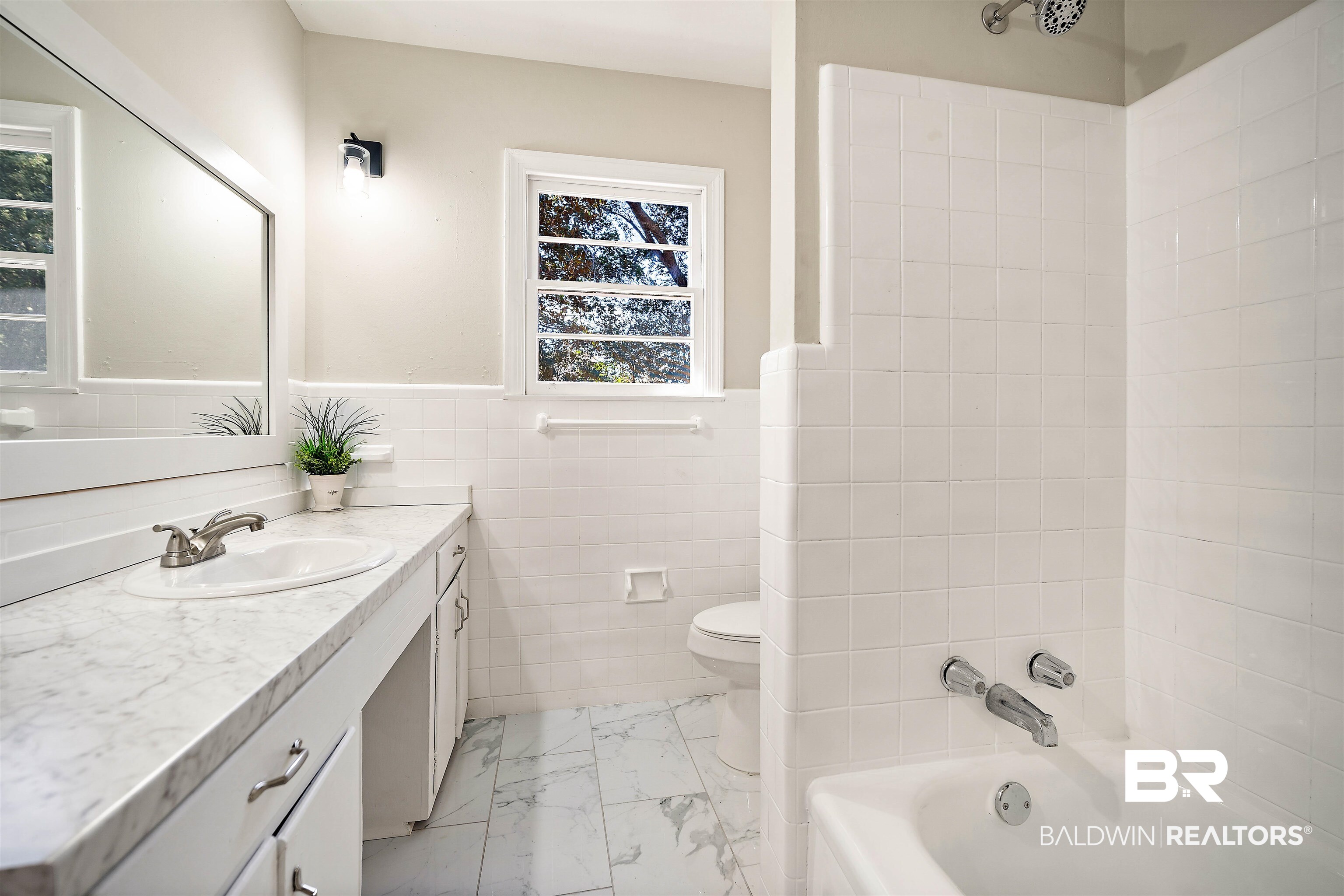 662 Merritt Drive Mobile, AL 36609 - Photo 15 of 21 Full bathroom featuring vanity, toilet, tile walls, and shower / washtub combination