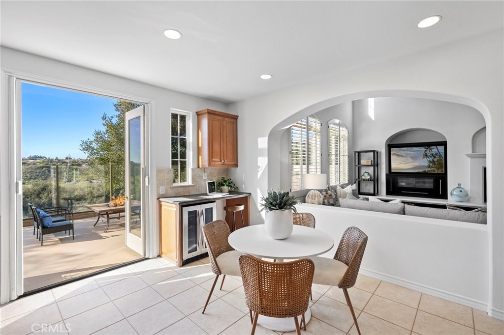 15 Mason Lane Ladera Ranch, CA 92694 - Photo 12 of 40 a living room with furniture a large window and a flat screen tv