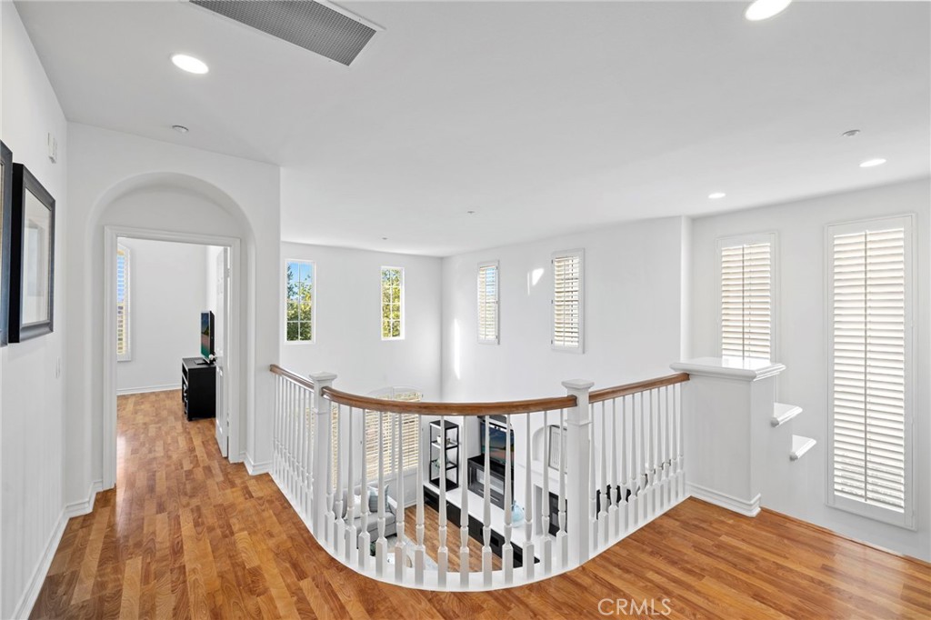 15 Mason Lane Ladera Ranch, CA 92694 - Photo 17 of 40 a view of a hallway with wooden floor and stairs