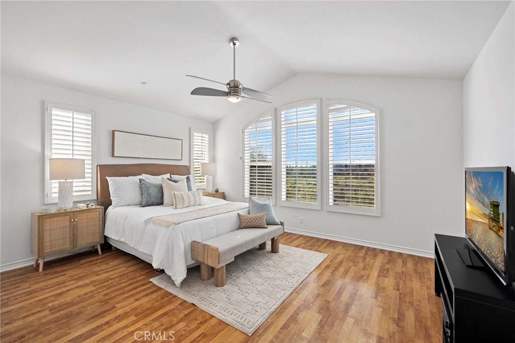 15 Mason Lane Ladera Ranch, CA 92694 - Photo 19 of 40 a bedroom with a large bed and a flat tv screen on dresser