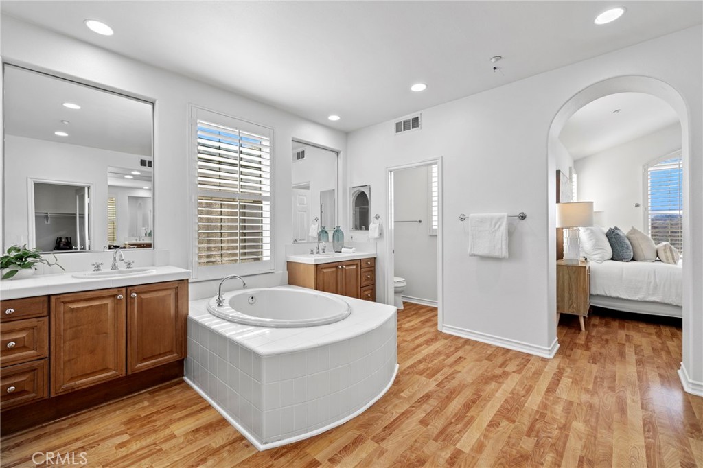 15 Mason Lane Ladera Ranch, CA 92694 - Photo 22 of 40 a large white room with a large tub and sink