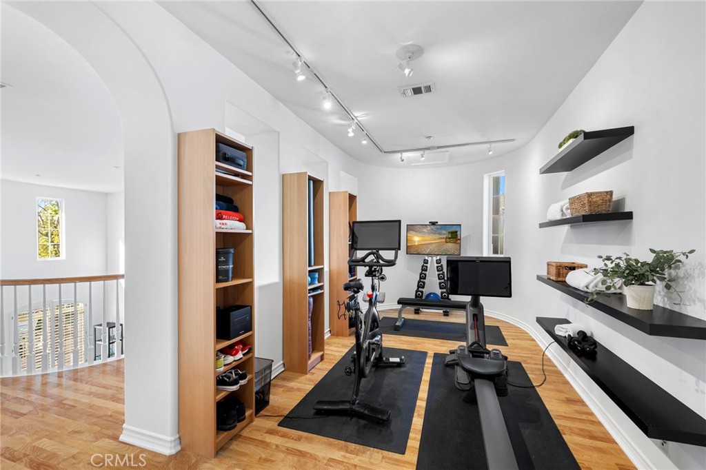 15 Mason Lane Ladera Ranch, CA 92694 - Photo 23 of 40 a room with furniture and gym equipment