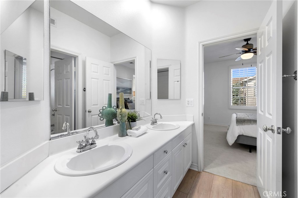 15 Mason Lane Ladera Ranch, CA 92694 - Photo 25 of 40 a en suite bathroom with double sink and a mirror