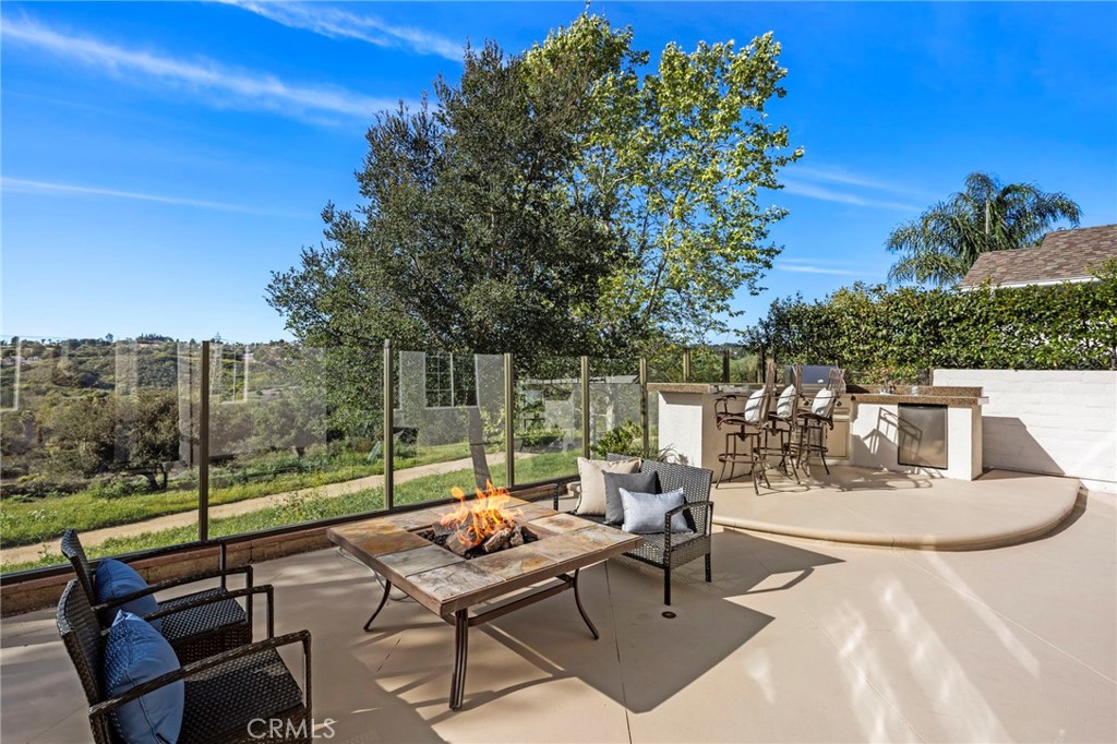 15 Mason Lane Ladera Ranch, CA 92694 - Photo 31 of 40 a view of a patio with a dining table and chairs with wooden floor