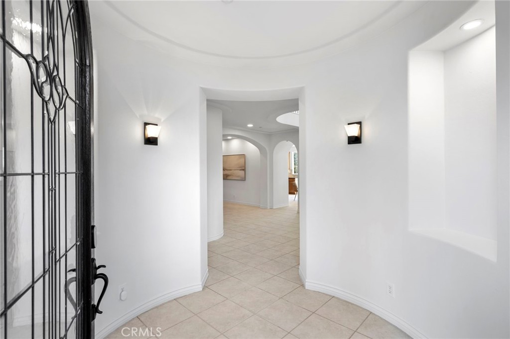 15 Mason Lane Ladera Ranch, CA 92694 - Photo 4 of 40 a view of a hallway with closet and mirror