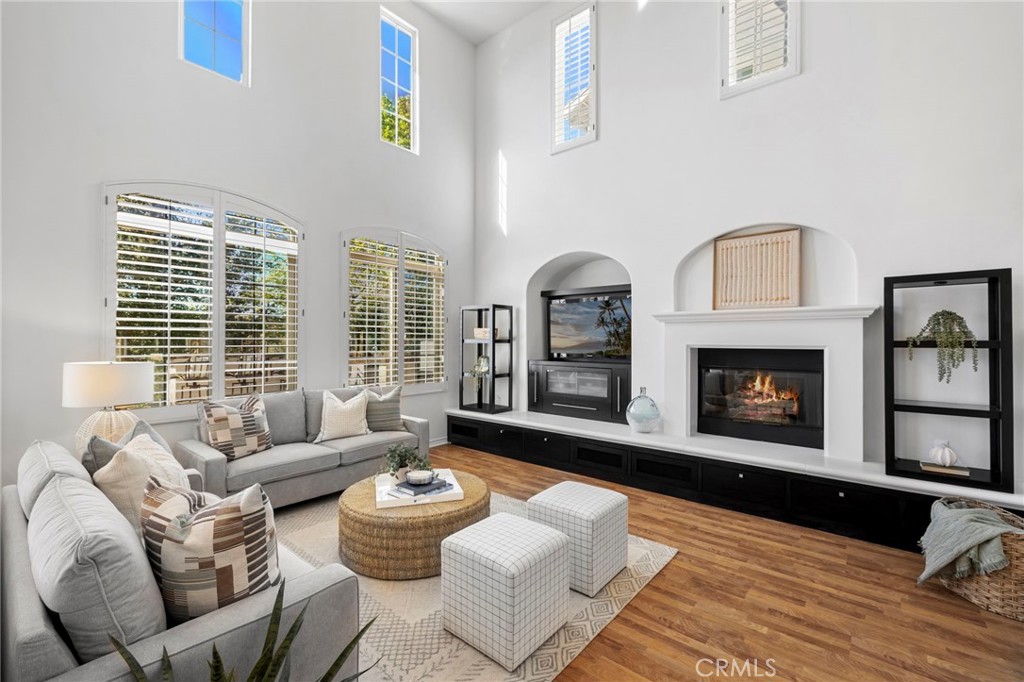 15 Mason Lane Ladera Ranch, CA 92694 - Photo 6 of 40 a living room with furniture and a fireplace