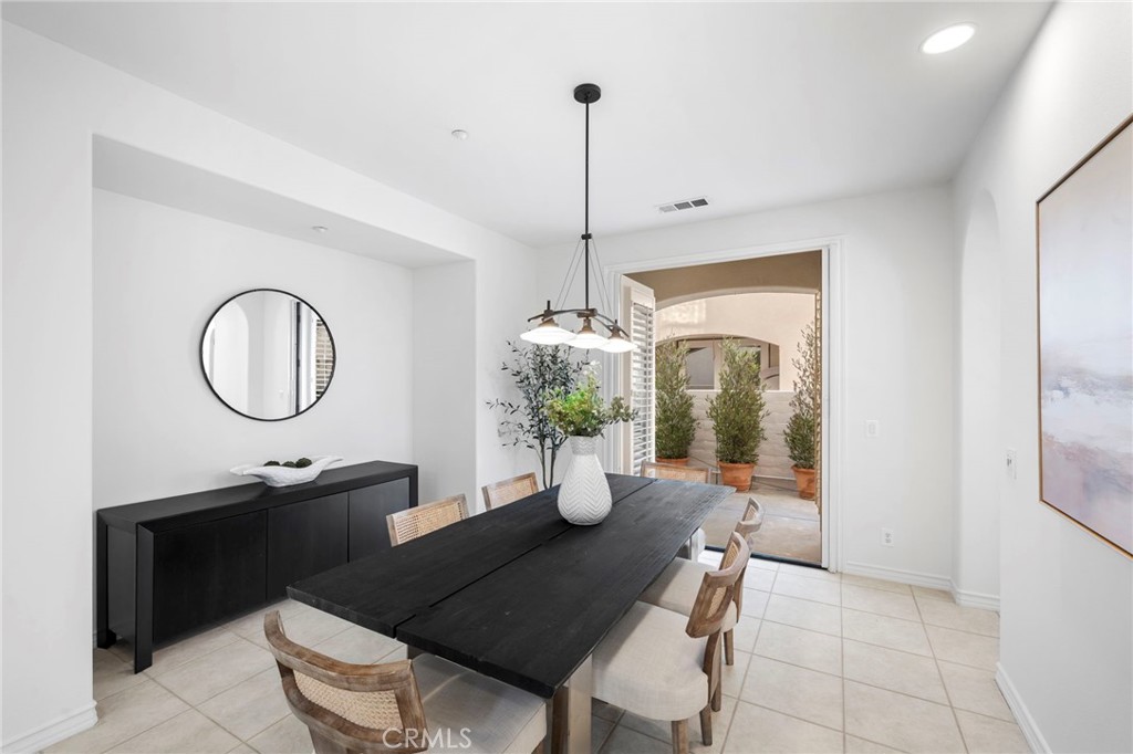 15 Mason Lane Ladera Ranch, CA 92694 - Photo 8 of 40 a dining room with chairs and window