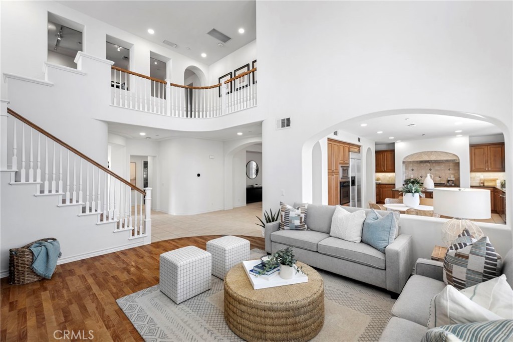15 Mason Lane Ladera Ranch, CA 92694 - Photo 9 of 40 a living room with furniture and a chandelier