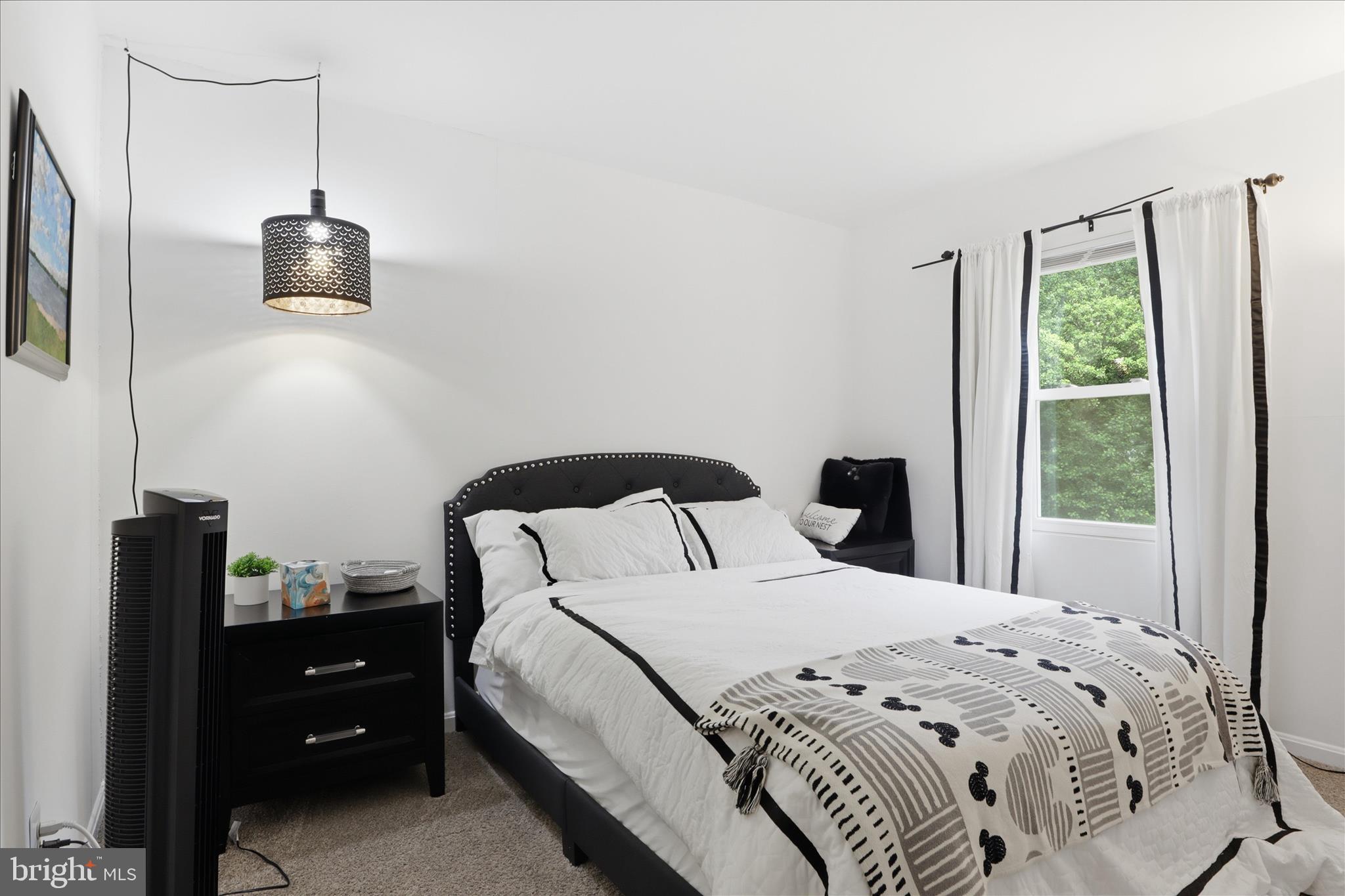 71 Kinsman View Circle Silver Spring, MD 20901 - Photo 20 of 42 a bedroom with a bed and a window