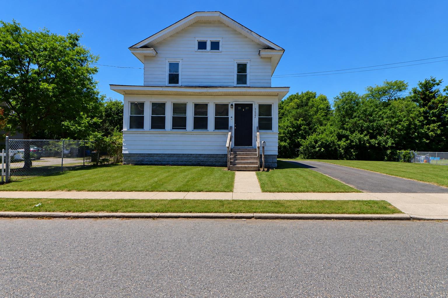 1022 Penn Line Road Paulsboro, NJ 08066 - Photo 1 of 19 a front view of a house with a yard